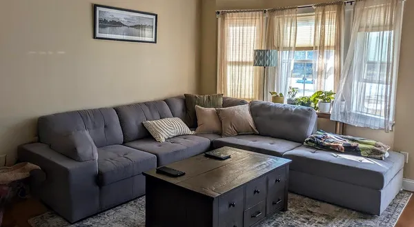 a living room with furniture and a window