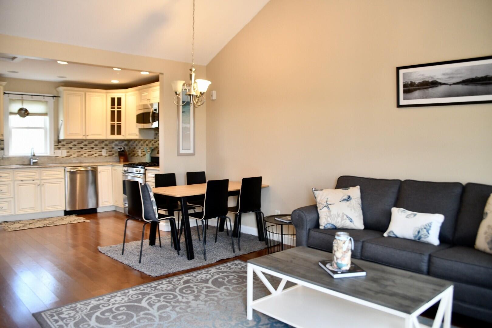 161 Route 28, Unit 7 Harwich, MA 02671 - Photo 17 of 17 a living room with lots of furniture and kitchen view