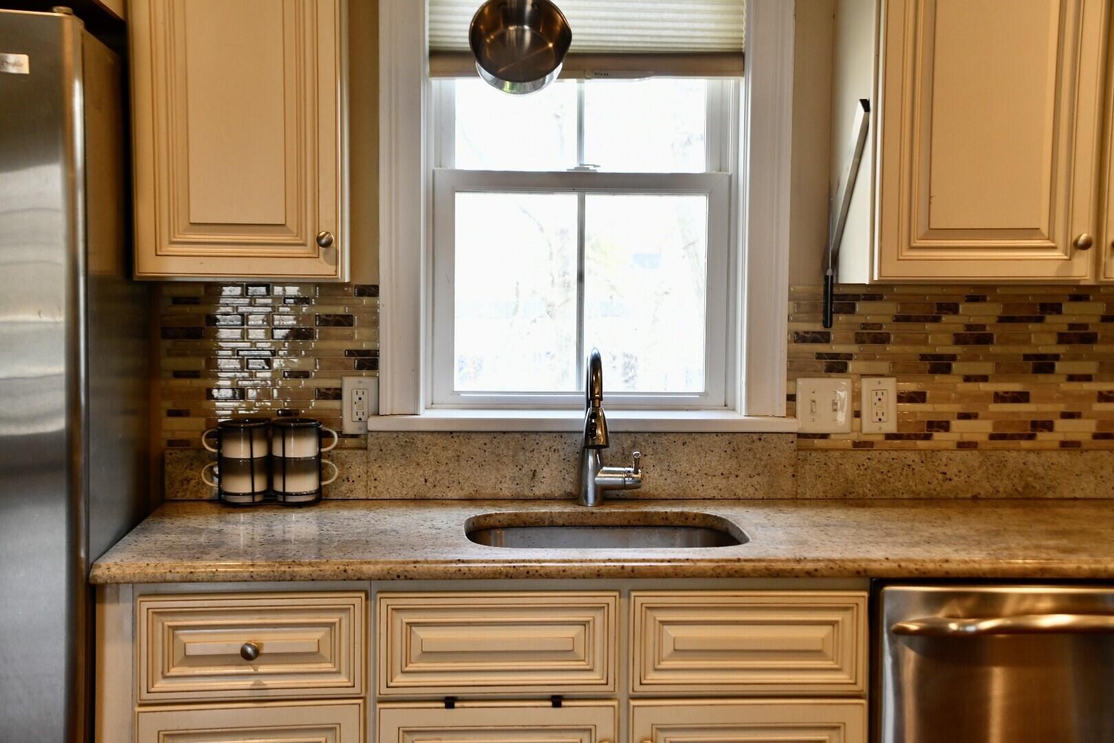 161 Route 28, Unit 7 Harwich, MA 02671 - Photo 4 of 17 a kitchen with a sink and a window