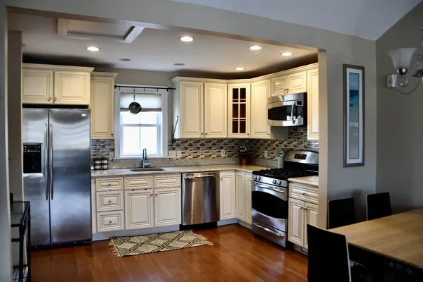 a kitchen with a sink and a window