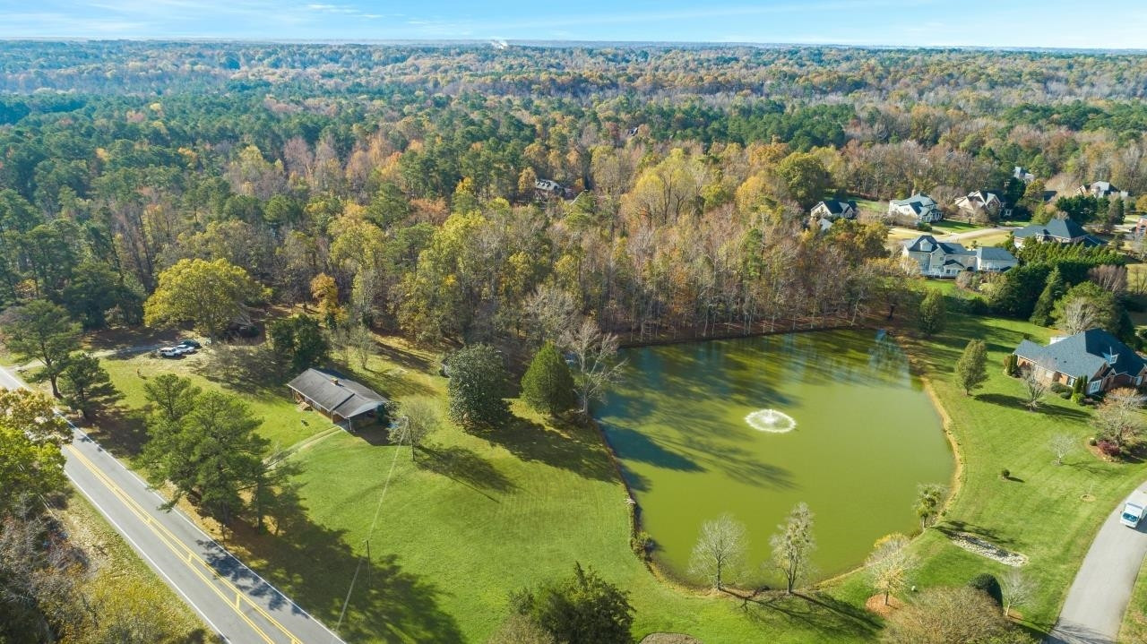 0 Penny Road Raleigh, NC 27606 - Photo 21 of 26 a view of a lake with houses