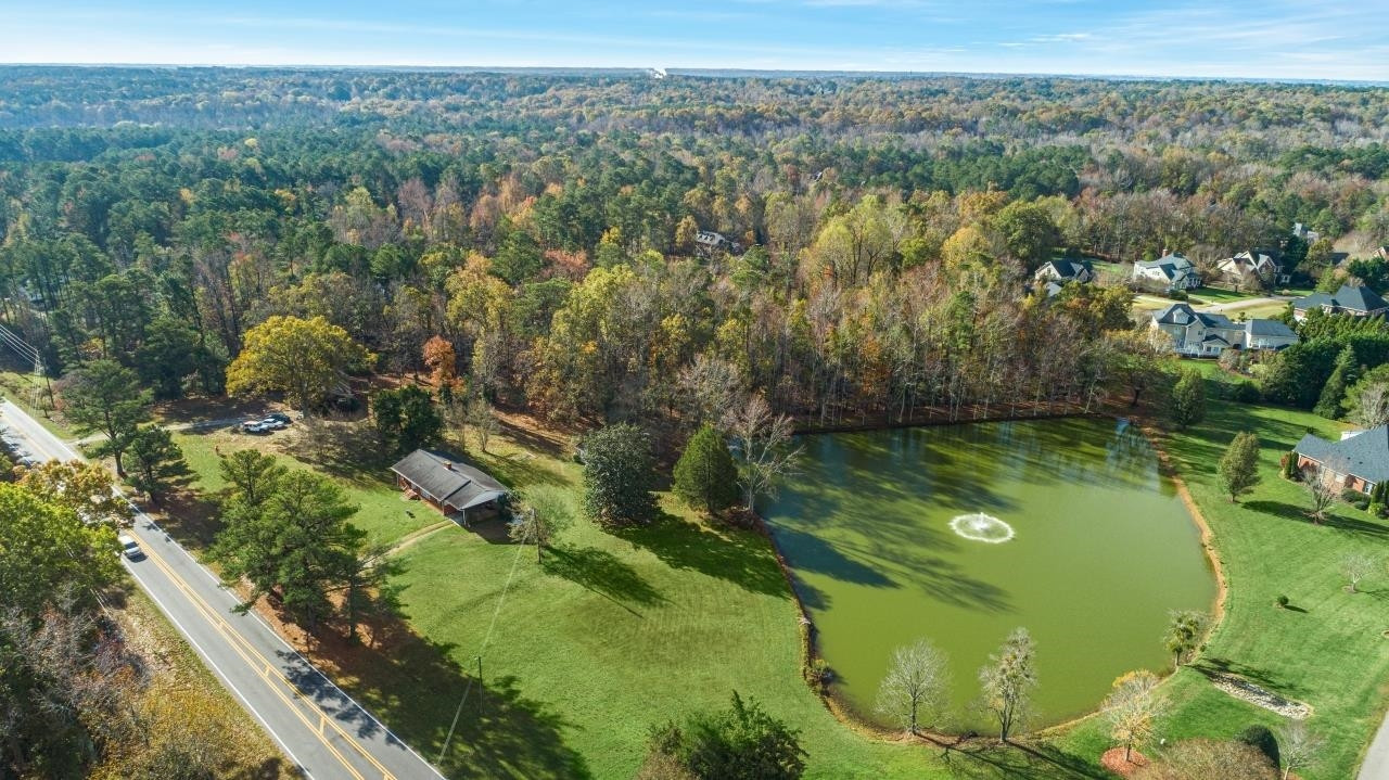 0 Penny Road Raleigh, NC 27606 - Photo 24 of 26 a view of a lake with a city