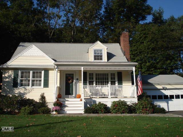 54 Flax Road Fairfield, CT 06824 - Photo 1 of 1 a front view of a house with a yard