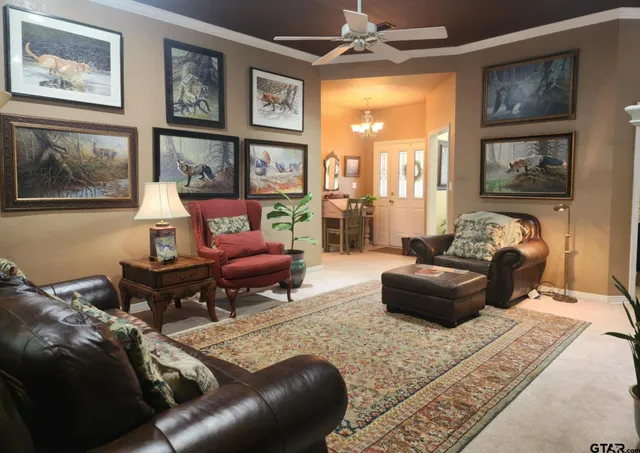 a living room with furniture and a fireplace