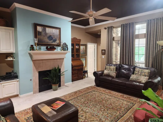 a living room with furniture and a fireplace