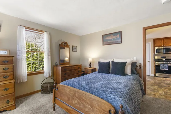 a bed room with a bed and a window