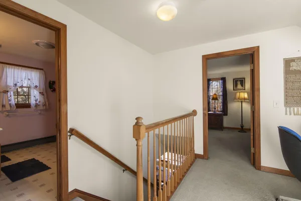 a view of a hallway with windows