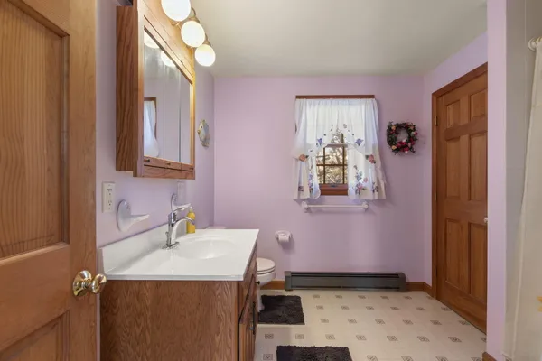 a bathroom with a sink a vanity and a mirror