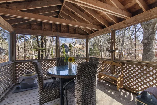 a view of a patio with wooden floor
