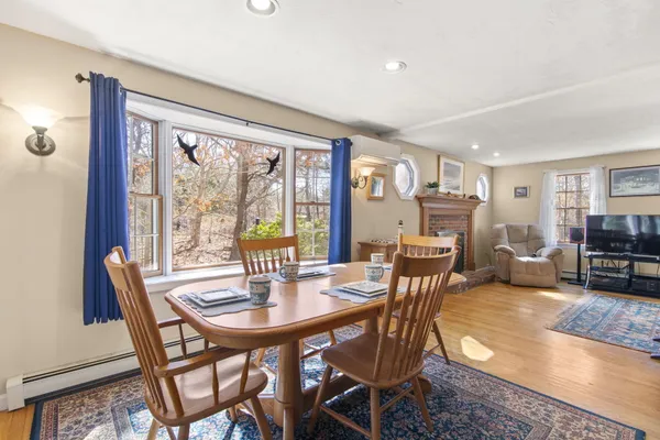 a view of a dining room with furniture window and outside view