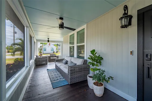 a living room with fireplace furniture and a wooden floor