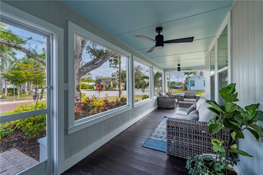 359 Gill Street Punta Gorda, FL 33950 - Photo 12 of 83 a living room with patio furniture and a potted plant