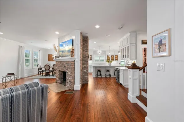 a view of a dining room with furniture and chandelier