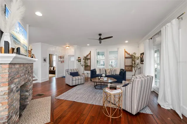 a kitchen that has a lot of cabinets and stainless steel appliances