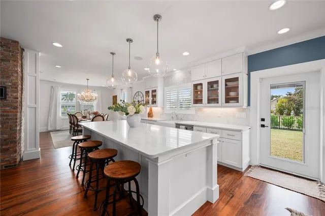 a bathroom with a sink mirror vanity and toilet