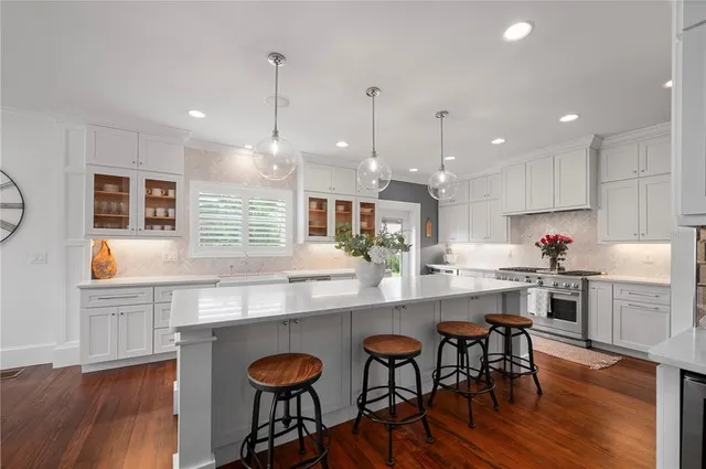 a spacious bedroom with a bed and a couch