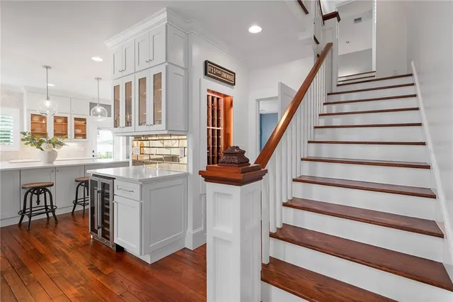 a bathroom with a granite countertop sink mirror and a bathtub
