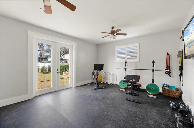 a spacious bedroom with a bed and a table in it