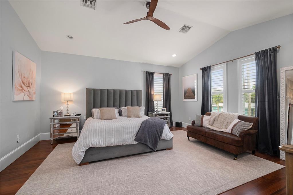 359 Gill Street Punta Gorda, FL 33950 - Photo 41 of 83 a spacious bedroom with a bed and a couch