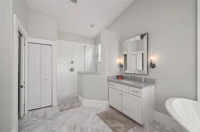 a front view of a house with a garden and plants