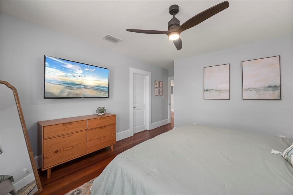 359 Gill Street Punta Gorda, FL 33950 - Photo 50 of 83 a bedroom with furniture and a flat screen tv
