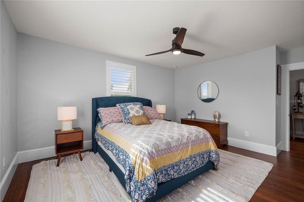 359 Gill Street Punta Gorda, FL 33950 - Photo 58 of 83 a bedroom with a bed chandelier and a window