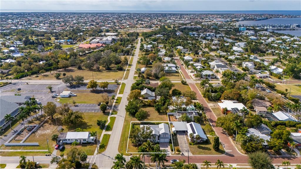359 Gill Street Punta Gorda, FL 33950 - Photo 77 of 83 an aerial view of residential building and parking space