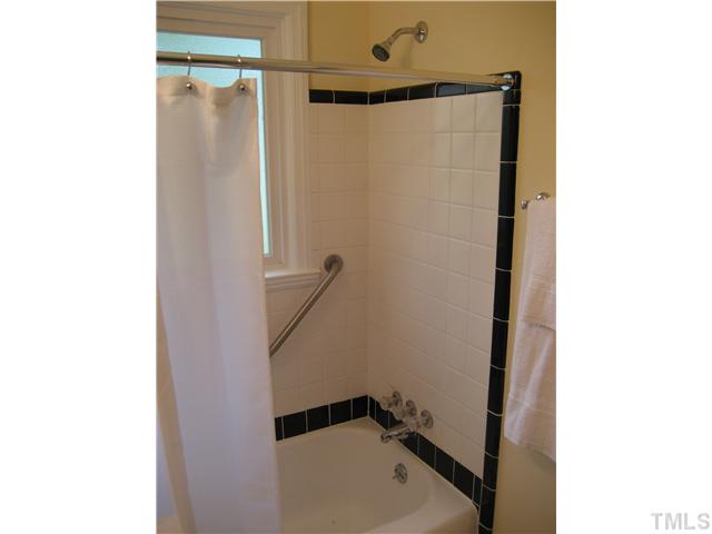 2109 Nelson Street Raleigh, NC 27610 - Photo 8 of 20 a bathroom with a shower and a sink