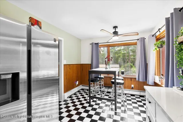 a living room with a table and a window