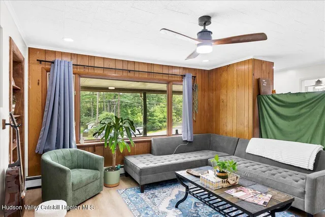 a living room with furniture and a window