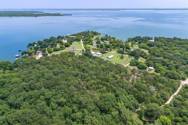 a view of a lake with a yard
