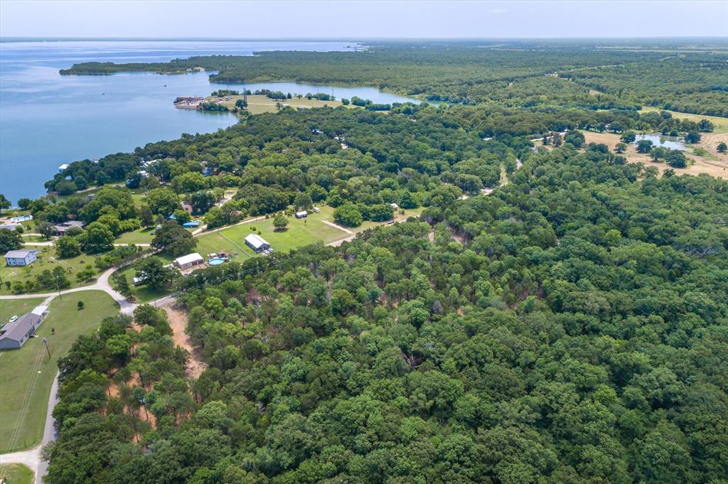 4407 County Road 3706 Wills Point, TX 75169 - Photo 7 of 11 an aerial view of a houses with a yard and lake view