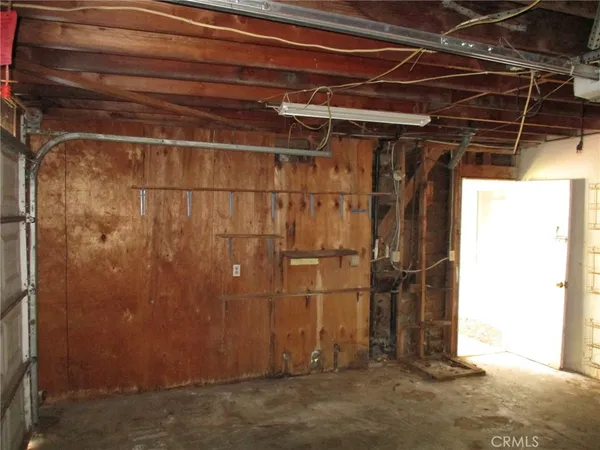 a view of a room with wooden walls