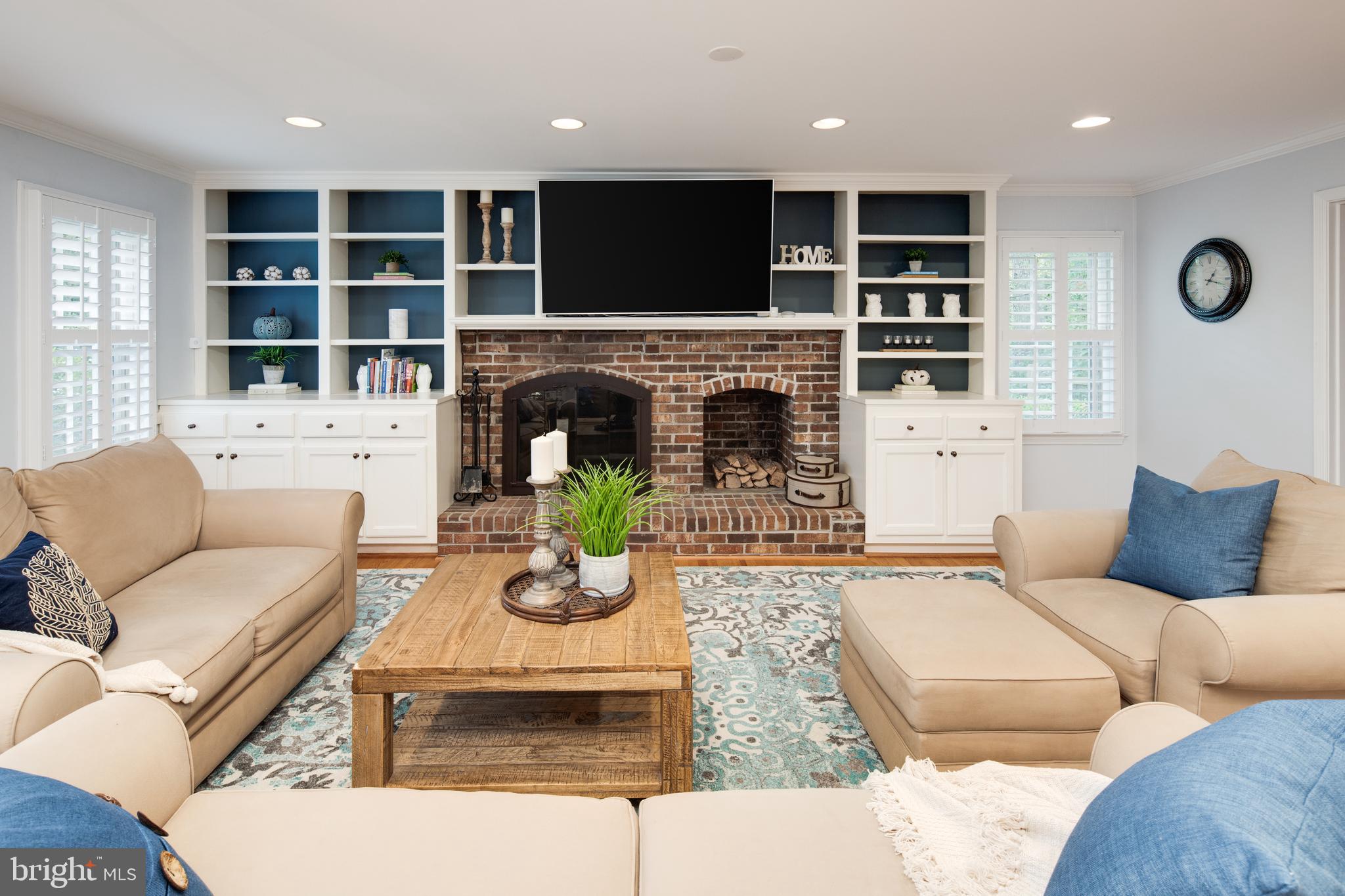 11005 Birdfoot Court Reston, VA 20191 - Photo 18 of 28 Family room with built-ins, hardwoods & fireplace.