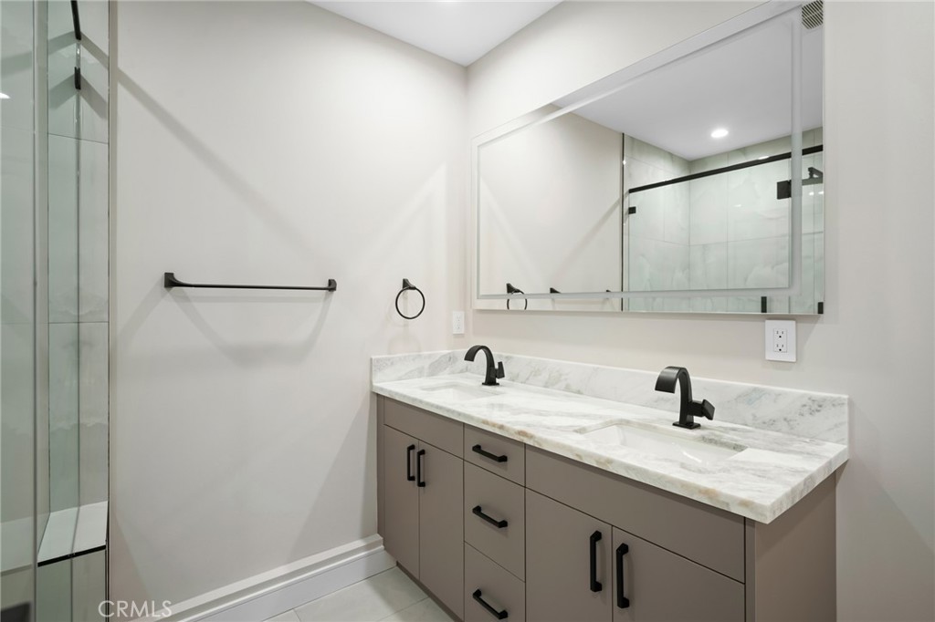19069 Celtic Street Porter Ranch, CA 91326 - Photo 14 of 17 a bathroom with a sink and a mirror