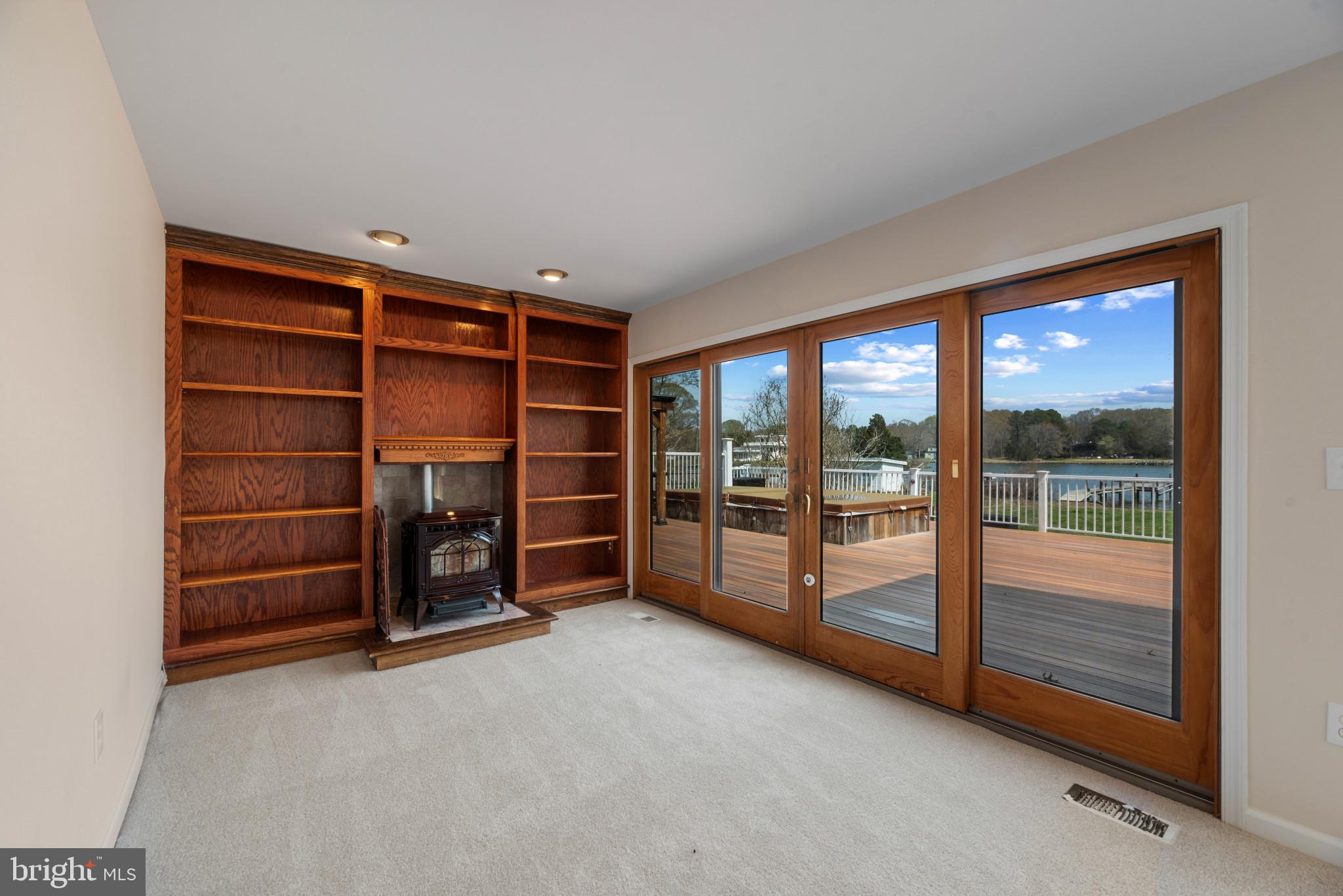 5929 Deale Beach Road Deale, MD 20751 - Photo 18 of 58 Unfurnished living room featuring a wood stove, a