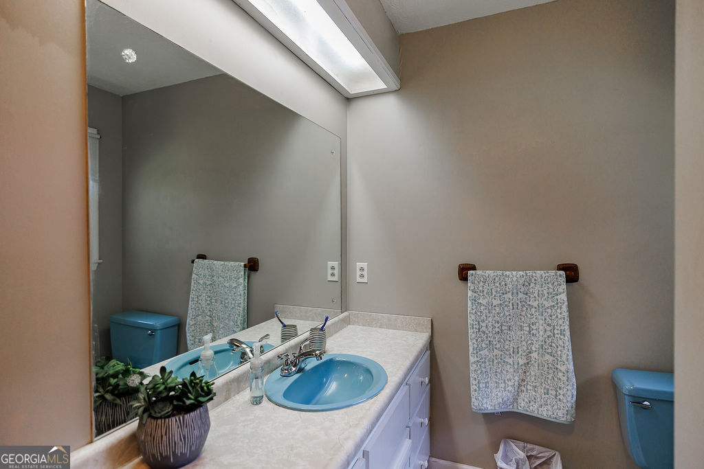 226 Baker Street Statham, GA 30666 - Photo 17 of 55 a bathroom with a sink and a mirror