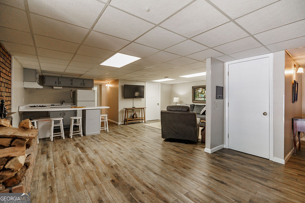 226 Baker Street Statham, GA 30666 - Photo 25 of 55 a large room with wooden floor