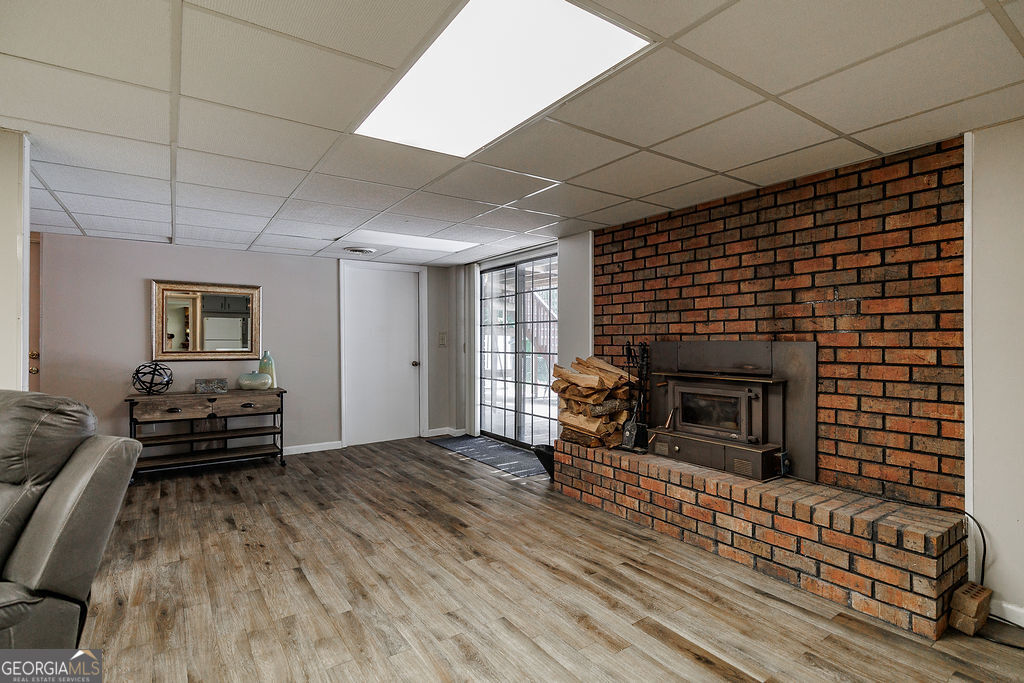226 Baker Street Statham, GA 30666 - Photo 27 of 55 a living room with furniture and a fireplace
