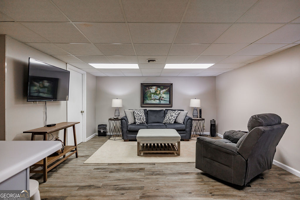 226 Baker Street Statham, GA 30666 - Photo 28 of 55 a living room with furniture and a flat screen tv