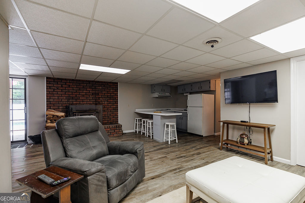 226 Baker Street Statham, GA 30666 - Photo 29 of 55 a living room with furniture and a flat screen tv