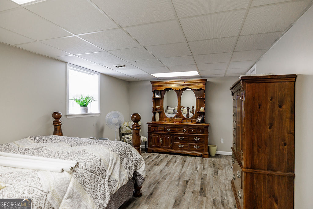 226 Baker Street Statham, GA 30666 - Photo 31 of 55 a bed room with a bed and a dresser