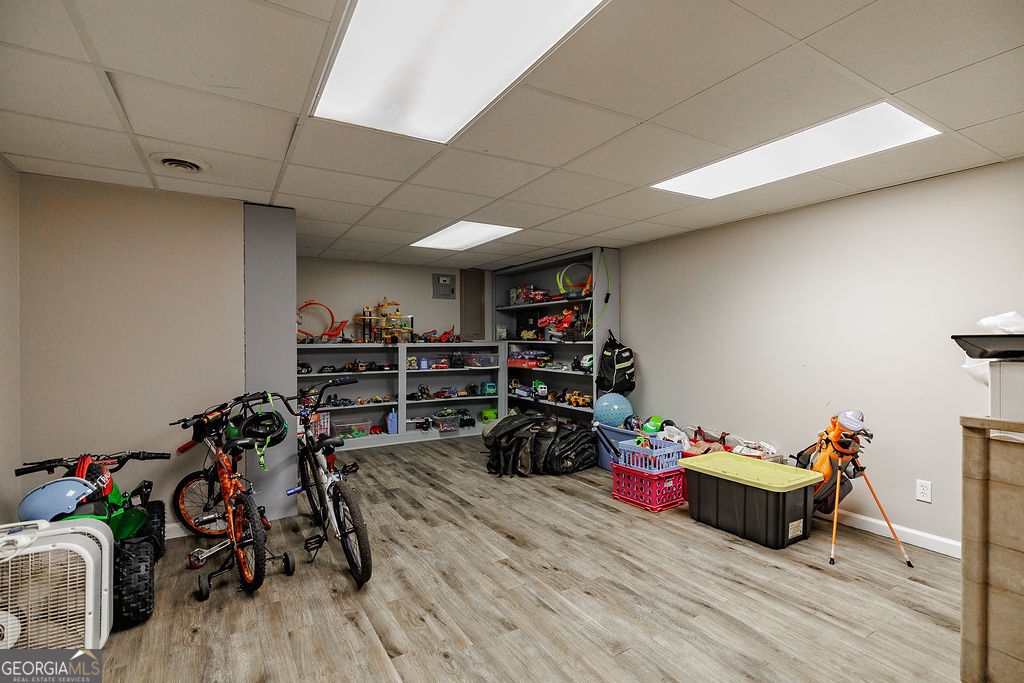 226 Baker Street Statham, GA 30666 - Photo 33 of 55 a room with gym equipment and wooden floor