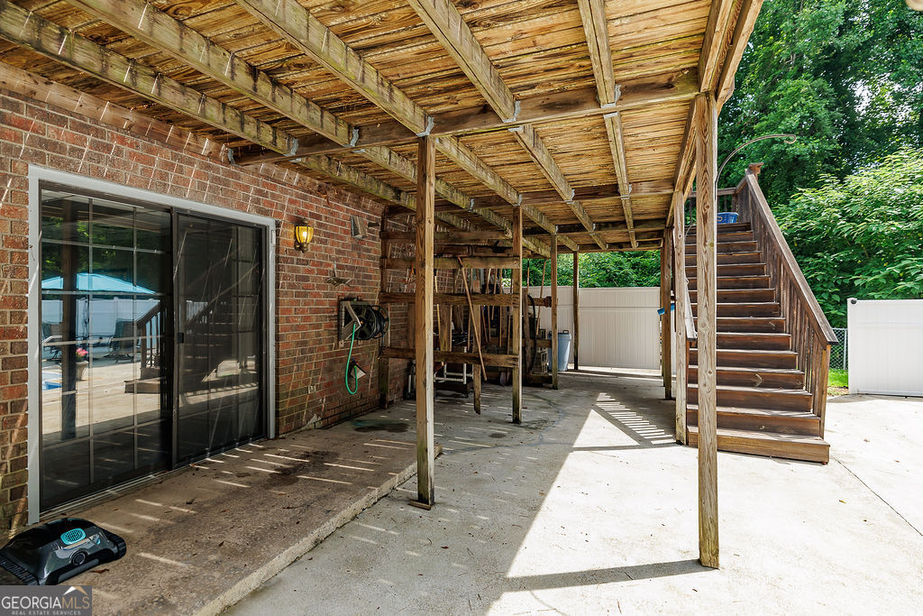 226 Baker Street Statham, GA 30666 - Photo 39 of 55 a view of a porch with wooden floor and stairs