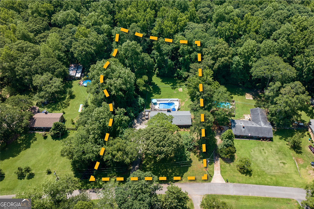 226 Baker Street Statham, GA 30666 - Photo 5 of 55 an aerial view of residential house with outdoor space and trees all around