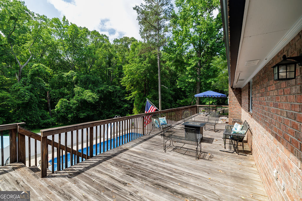 226 Baker Street Statham, GA 30666 - Photo 51 of 55 a view of backyard with seating area and trees