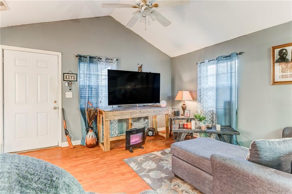 213 Iron Street Northwest Rome, GA 30165 - Photo 11 of 28 a living room with furniture and a flat screen tv