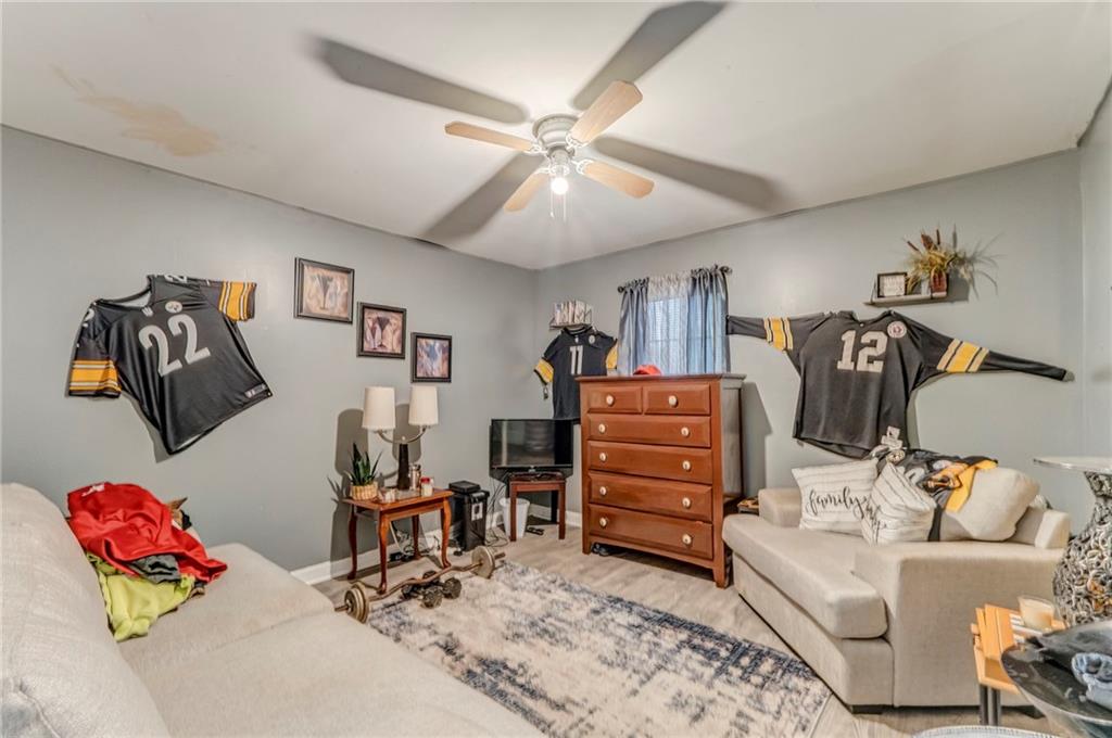 213 Iron Street Northwest Rome, GA 30165 - Photo 19 of 28 a living room with furniture and a flat screen tv