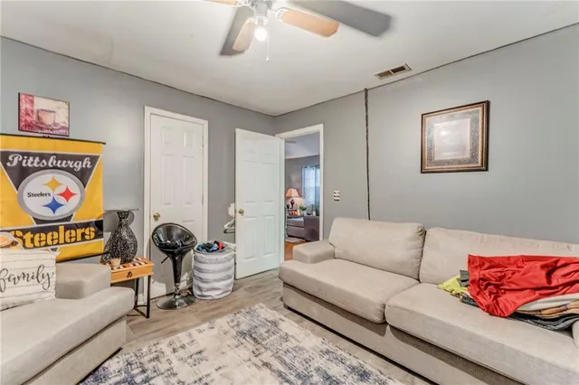 a living room with furniture and a rug