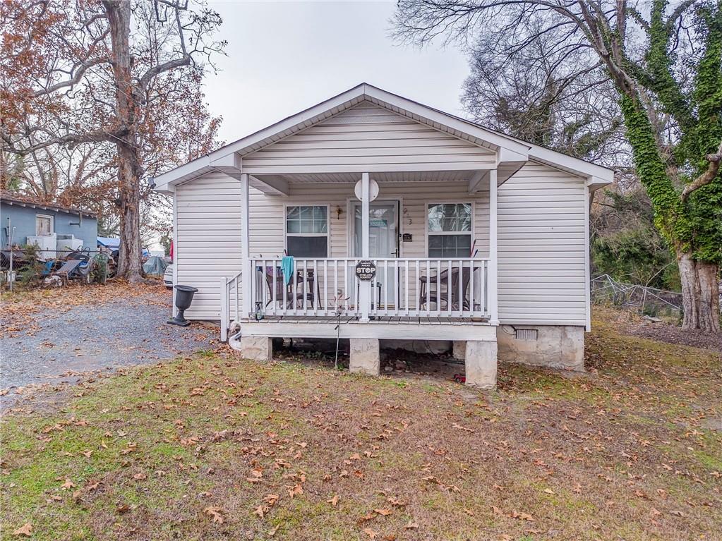 213 Iron Street Northwest Rome, GA 30165 - Photo 2 of 28 a view of a house with a yard and sitting area